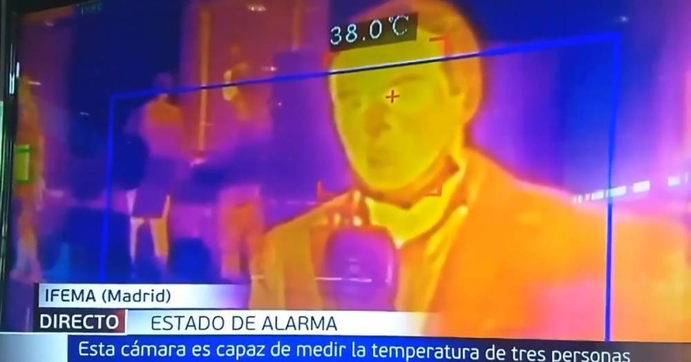 Journalist diagnosed with fever on live TV after checking temperature outside hospital - dailystar.co.uk - Spain - city Madrid, Spain