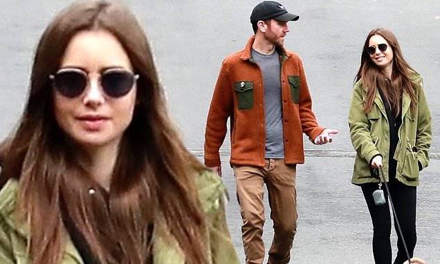 Phil Collins - Lily Collins - Lily Collins is stylish in green jacket and black leggings as she walks dog with Charlie McDowell - dailymail.co.uk - Britain - state California - county Collin