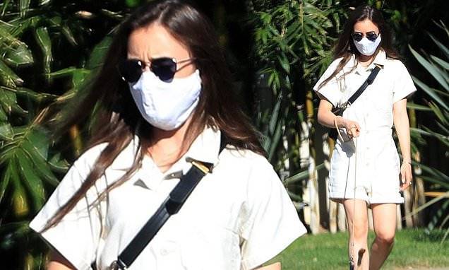 Lily Collins - Lily Collins is a vision in a white romper as she goes for a masked stroll with her pet pooch - dailymail.co.uk - state California - Los Angeles, state California