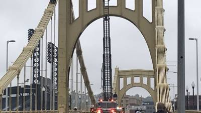 2 face charges after trying to hang protest banner from bridge in Pittsburgh - fox29.com - county Bureau