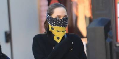 Angelina Swaps a Face Mask for a Silk Scarf in Los Angeles - harpersbazaar.com - Los Angeles - county Angelina - county Pitt