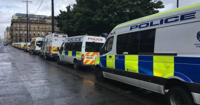 Coronavirus - Heavy police presence guards George Square as special powers to search 'any individual or vehicle' enforced over riots - dailyrecord.co.uk - Scotland - city Glasgow