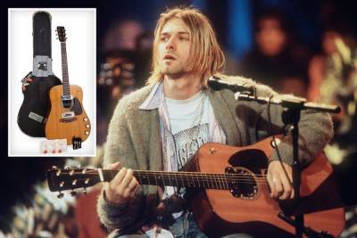 Health - Kurt Cobain’s iconic acoustic guitar from Nirvana’s MTV Unplugged performance sells for record £4.8million - thesun.co.uk - New York - city Beverly Hills