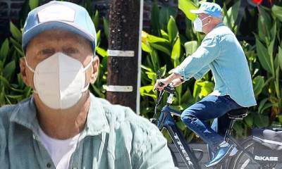 Bruce Willis - Simon Cowell - Bruce Willis masks up while riding e-bike during casual shopping trip amid coronavirus pandemic - dailymail.co.uk - Britain - state California - city Santa Monica, state California - city Malibu, state California
