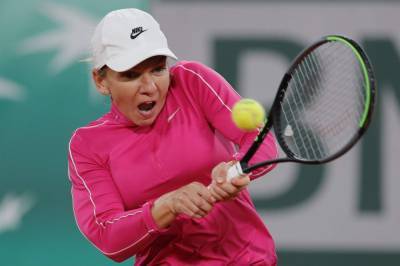 Roland Garros - Ash Barty - Former champ Halep reaches French Open 2nd round, Goffin out - clickorlando.com - Spain - France - city Rome - city Prague