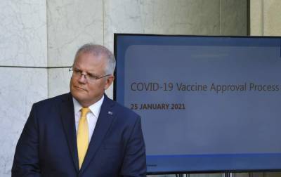 Scott Morrison - Asia Today: Australia OKs Pfizer vaccine, to begin in Feb. - clickorlando.com - Australia