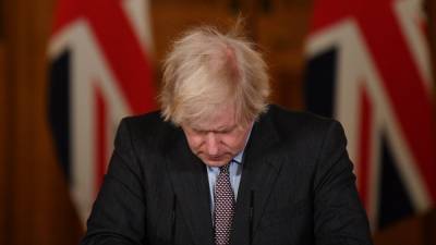 Boris Johnson - Priti Patel - Keir Starmer - Johnson 'sorry' as UK virus death toll passes 100,000 - rte.ie - Britain