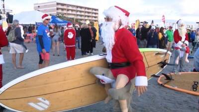 Surfing Santas returns to Cocoa Beach with large crowds - fox29.com - county Brevard