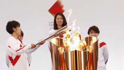 Olympic torch relay gets going in Japan under pandemic shadow - rte.ie - Japan - city Tokyo