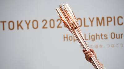 Tokyo Olympics organisers report first torch relay virus case - rte.ie - city Tokyo