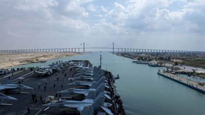 US Navy aircraft carrier passes through Suez Canal after crews free stranded cargo ship - fox29.com - Usa - Egypt