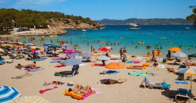 Holiday blow as beloved tourist hotspots bring in tough new Covid rules - dailystar.co.uk - Spain - county Island