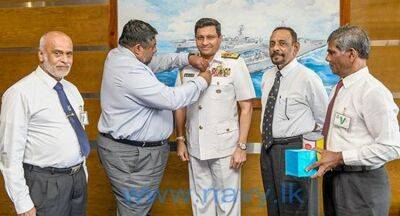 Nishantha Ulugetenne - Poppy flower pinned on Navy Chief - newsfirst.lk - Sri Lanka