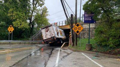 Tractor-trailer crashes into bridge, shuts down road in Radnor - fox29.com