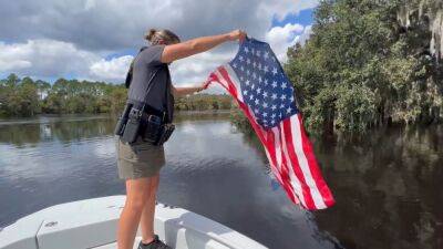 Florida deputies rescue American flag from swollen river after Hurricane Ian - fox29.com