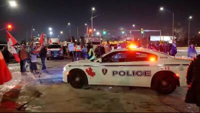 Trucker protest, days-long blockade at U.S.-Canada border shuts down auto factories - fox29.com - Canada - county Ontario - county Windsor - state Michigan - city Lansing, state Michigan