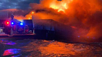 Fire erupts on Delaware Bay barge, Coast Guard and local crews fight blaze - fox29.com - state Delaware