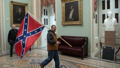 Donald Trump - George Floyd - Dad who carried Confederate flag into Capitol during Jan. 6 riot heads to trial - fox29.com - Usa - area District Of Columbia - state Delaware - city Washington - Washington, area District Of Columbia - state New Mexico - city Minneapolis