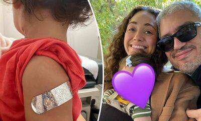 Emmy Rossum shares rare photo of daughter, one, getting COVID-19 vaccine - dailymail.co.uk