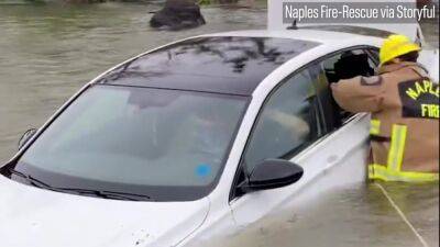Watch: Firefighters smash car window to rescue woman from Ian floodwaters - fox29.com - state Florida - county Collier - city Naples