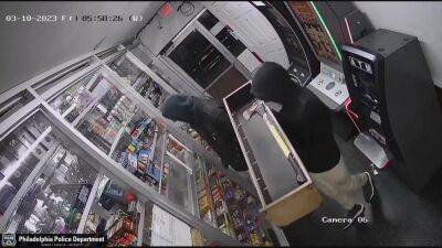 Video: Suspects armed with ax try to chop open ATM in Eastwick convenience store robbery - fox29.com - city Philadelphia